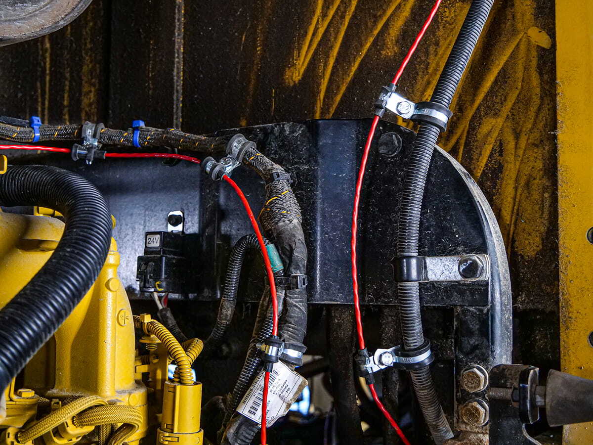 Electronic linear heat detection cable installed on heavy machinery fire suppression system
