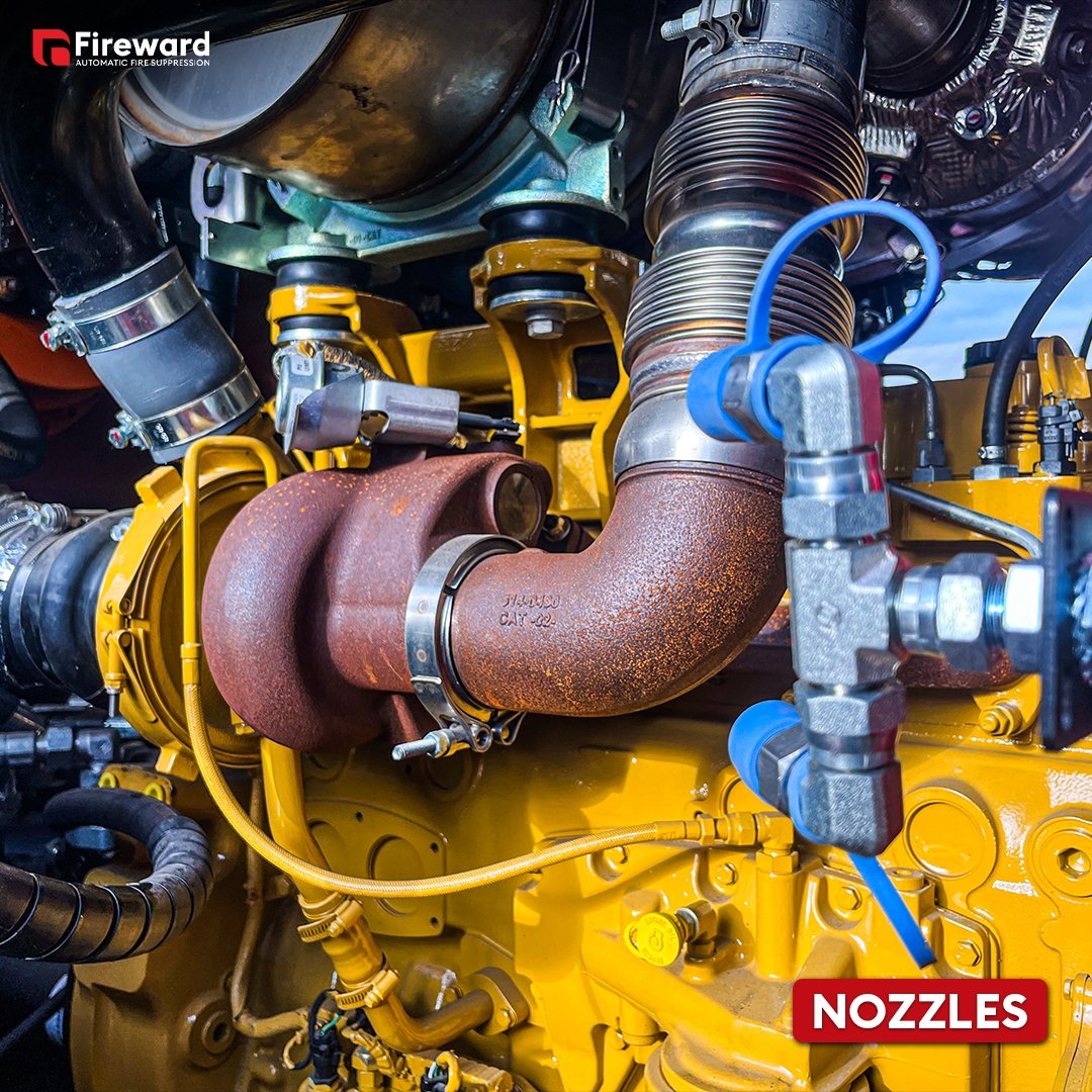 Fire suppression system release nozzles aiming at hot exhaust