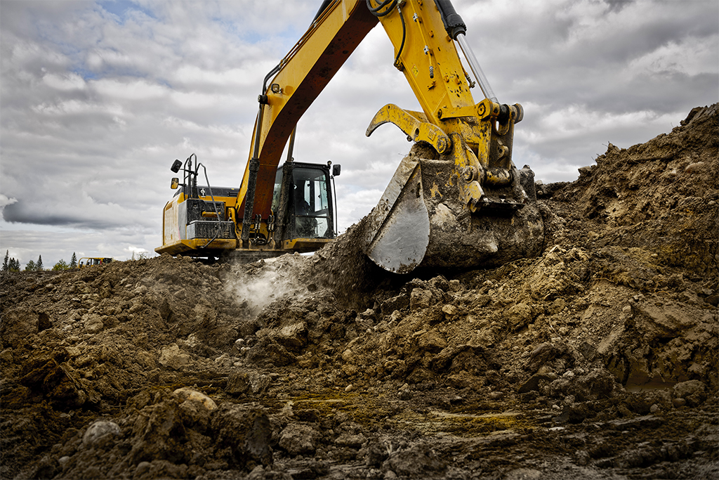 An excavator digging up dirt